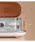 Slick Mini Ultrasonic Cleaner Doing Heavy Lifting For Jewelry And Eyewear Washing Machine with visible cleaning chamber.