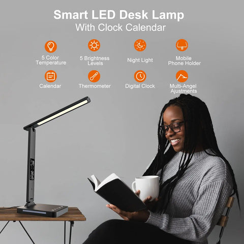 LED Desk Lamp With Wireless Charger and USB Port, Built-In Clock, Alarm, Date and Temp; black finish, on a home desk
