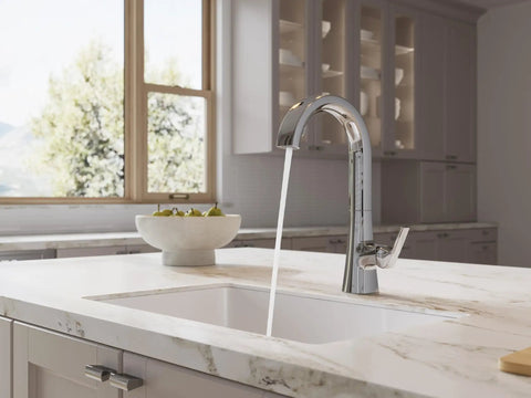 Pfister Vaneri Kitchen Faucet with Pull Down Sprayer, Polished Chrome, showcasing a high arc spout with water flowing in a bright kitchen.