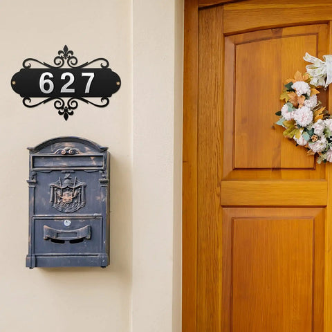 13.8 Inch Iron Address Plaque With Ten 2.75 Inch House Numbers displayed above a decorative mailbox on a home exterior wall.