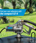 Heavy Duty 8 GPM Electric Fuel Transfer Pump With Spin Collar And Manual Shut Off Nozzle For Gasoline And Diesel 12 Volt on tank outdoors.
