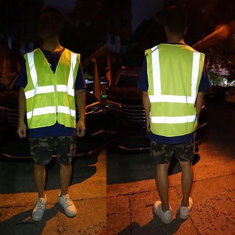 Person wearing Top Shelf High Visibility Reflective Safety Vest, Fluorescent Neon Yellow, heavy duty construction work gear.