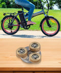 36T Copper Gear Set For Electric Bike Hub Motor Planetary System With Bearing And Copper Clutch Gear For E Bike Conversion Kit 38x38x12mm Built To Last Ride on a table with a bicycle in background.