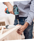 Person using a drill to install Pro Grade Barn Door Roller Hardware Replacement Kit featuring heavy duty directional caster wheels.