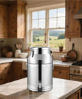 Heavy Duty Workhorse 304 Stainless Steel Milk Can With Spigot 16.9 Gallon in a kitchen setting on a marble countertop.