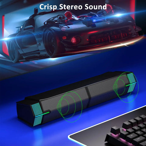 M20 USB Powered Desktop Speakers For PC Monitor And Gaming Rig with RGB lighting displayed near a racing game setup