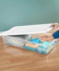 No Hassle Clutter Crusher, Slick Locking Lids, Heavy Duty Stackable Containers For Closet And Home Organization, Roomy 56 Quart Capacity, Clear With White Tops, 12 Pack Deal with stacked clothes.