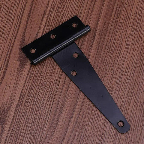Close-up of a single black 4-inch T-shaped rustproof hinge on wood surface, part of 12 Pack 4 Inch T Shaped Rustproof Iron Light Duty Hinge Set In Black For Sheds Gates And Doors Durable Corrosion Resistant Easy Install With 6 Screw Holes Quiet Smooth Swing Built To Last Ideal For Indoor Outdoor Use