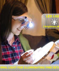Woman using Lighted Magnifier Headset With Five Interchangeable Lenses for embroidery, LED light illuminating work area