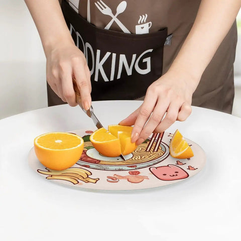 Person cutting oranges on Tempered Glass Cutting Board Counter Protector For Kitchen Home Office And Travel Portable Non Slip Cutting Surface That Resists Knife Marks Easy Clean Up And Keeps Your Prep Space Sleek And Clean