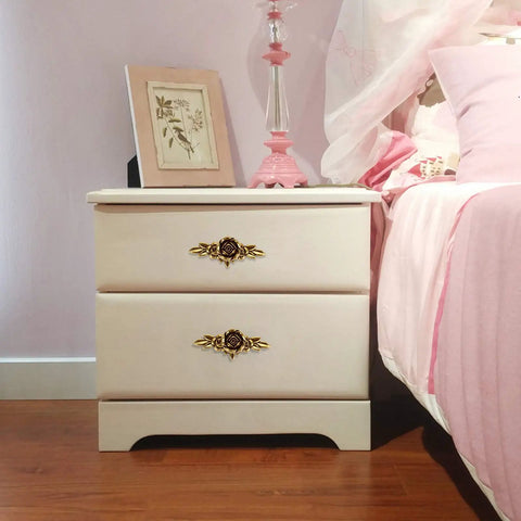 Euro Rose Floral Ivory Cabinet Knobs With Backplates Set Of 5 on bedroom dresser next to pink bed