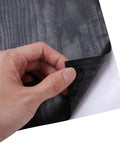 Close-up of hand peeling Removable Self Adhesive Wallpaper Roll For Waterproof Cabinet Makeover And Buttery Smooth Peel Stick Furniture Wrap.