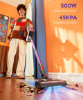 Person using cordless vacuum cleaner with 500W motor and 45KPa suction, self standing stick vacuum for home, LED light on hard floor