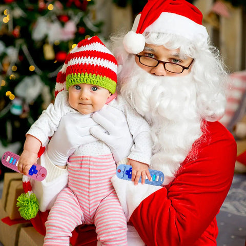 Baby holding TV Remote Shaped Silicone Teething Toy For Babies 3 to 18 Months BPA Free Refrigerator Safe with Santa