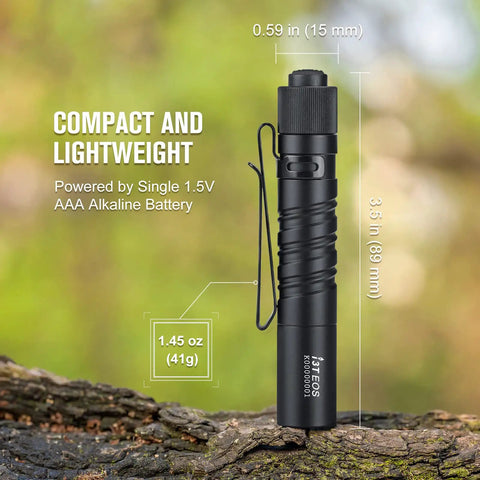 Compact AAA Powered EDC Flashlight For Camping And Hiking With Tail Switch 180 Lumens Beam, slim design on forest background.