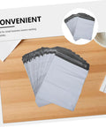 Waterproof Poly Mailer Bags 10x14 Inches White Self Seal Envelopes on wooden table