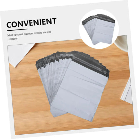 Waterproof Poly Mailer Bags 10x14 Inches White Self Seal Envelopes on wooden table