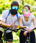 Two cyclists wearing 24 Piece Polarized Sports Sunglasses And Breathable Neck Gaiter Face Mask Set For Men Women outdoor gear.