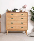 Antique Bronze Flower Drawer Knobs 12 Pack Vintage Sunburst Cabinet Pulls on a wooden dresser with modern decor.