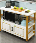 Kitchen island with microwave, knives, cutting board with fruits, and kitchen hooks, set against light blue cabinets in a modern kitchen.