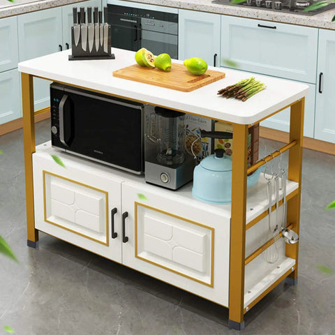 Kitchen island with microwave, knives, cutting board with fruits, and kitchen hooks, set against light blue cabinets in a modern kitchen.