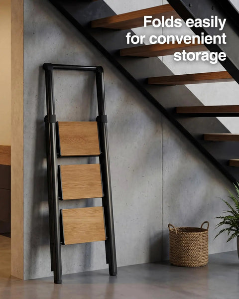 Three Step Folding Ladder With Anti Slip Wide Pedals And Handgrip, Aluminum Lightweight Steel Frame, 330 Lb Capacity For Home And Office, Black Woodgrain Finish folded flat by stairs