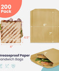 Greaseproof Paper Sandwich Bags 200 Pack 7 By 6 By 1 Inches Unbleached Brown Bags For Bakery Donuts Bagels Snacks Grab And Go Recyclable Food Safe No Wax 100 Percent Food Grade Eco Friendly; image showing bag size and sandwich use.