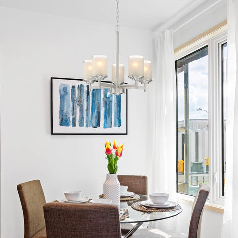 Dining room with Modern Farmhouse 19 Inch 5 Light Chandelier in Brushed Nickel Finish, frosted linen glass shades above table.