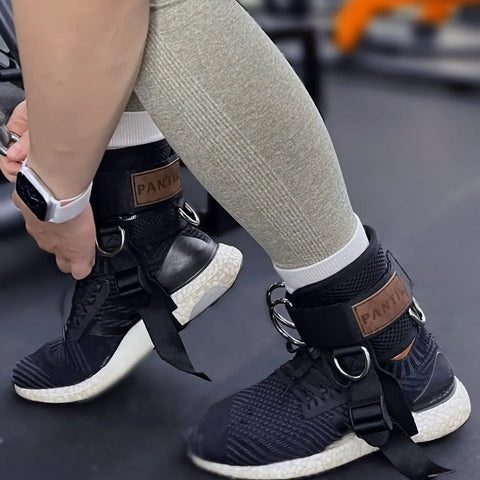 Secure Fit Two Pack Ankle Straps For Cable Machine With Crazy Comfy Neoprene Padding And Bombproof Steel Double Hooks in use with gym shoes.