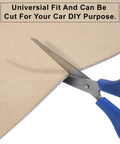 Beige suede headliner fabric with foam backing for automotive interiors; close-up of scissors cutting its edge