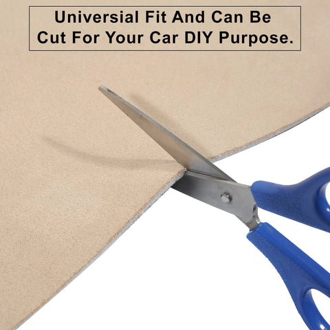 Beige suede headliner fabric with foam backing for automotive interiors; close-up of scissors cutting its edge
