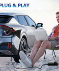 Portable V2L Converter For Electric Vehicles Morphs Charging Port Into Legit US AC Outlet at the beach.