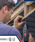 Person using drill with 40 Pack One Half Inch By Four Inch Stainless Steel Lag Bolts With Forty Washers Kit For Outdoor Wood Projects Decks Fences Heavy Duty Hardware Built To Last In Humid Environments