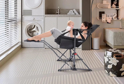Woman using the Ultimate Outdoor Hammock Chair With Removable Footrest And Stand indoors