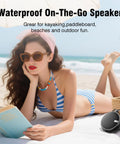 Rugged IP67 Waterproof Bluetooth Speaker With Submersible Design, Portable Tiny Speaker With TF Card Support at the beach.