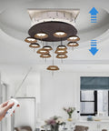 Top Tier Electric Chandelier Hoist With Remote Control Heavy Duty Lifting System Holds 330 Pounds lowering a modern lamp.