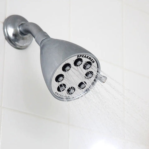 Stainless steel showerhead in use, part of Brass Shower Trim Kit S2251E175 With Icon Compatibility, mounted on bathroom wall.