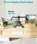 Top view of Dual Monitor Stand For 13 To 27 Inch Screens, Free Standing Full Motion Desk Mount with two monitors on a wooden desk