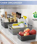 3 Pack Small Plastic Storage Baskets In Sleek Dark Gray For Hassle Free Home Organization And Pantry Reset With Heavy Duty Wicker Look Design A Fast Fix For Bedroom Kitchen Laundry Cabinet Countertop on a kitchen countertop organizing items.