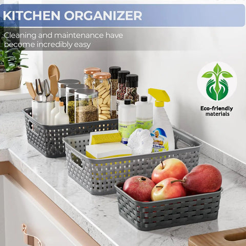 3 Pack Small Plastic Storage Baskets In Sleek Dark Gray For Hassle Free Home Organization And Pantry Reset With Heavy Duty Wicker Look Design A Fast Fix For Bedroom Kitchen Laundry Cabinet Countertop on a kitchen countertop organizing items.