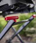 Close-up of Portable Folding Grill Cart With All Terrain Wheels For On The Go Grillin Heavy Duty Strap Keeps Your Grill Secured