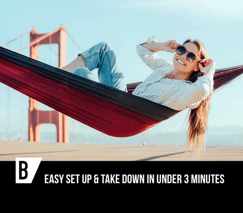 Woman relaxing in Two Person Camping Hammock, Super Easy Setup And Take Down, 10 Ft Long By 6 Ft Wide, with bridge view