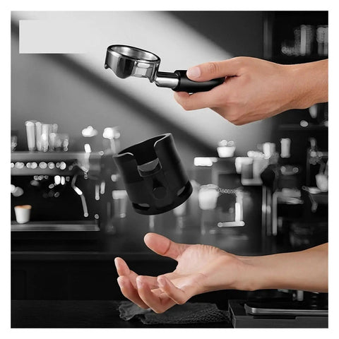 58mm Adjustable Portafilter Holder And Espresso Tamping Station being held above a hand for easy use and stability.