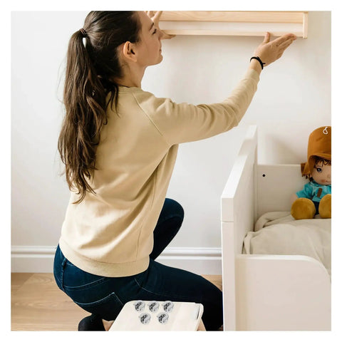Woman assembling furniture using Cam Lock Pins Kit 10 Pcs Furniture Connecting Brackets for Cabinets and Wardrobes.