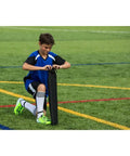 Child setting up Portable Backyard Soccer Goal Small Size Pop Up With Quick Setup Durable Fiberglass Frame All Weather Practice Net