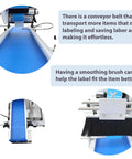 Close-up of Straight Up Real Deal Fully Automatic Labeling Machine For Flat Surfaces with conveyor belt and smoothing brush.
