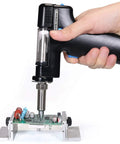 Replacement Desoldering Gun Handpiece For 948 And 948-II Soldering Stations in use on circuit board, black handle, durable suction tip