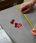 Eight Pack Nonslip Planing Stoppers for Workbenches, Aluminum Alloy Positioning Plugs With Quick Release next to measuring tape