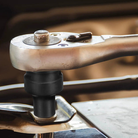 Pro Grade 14Millimeter 4 Point Square Impact Socket Half Inch Drive Cr Mo Steel Wheel Tool mounted on ratchet for rusted bolts.