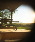 Stinger Adjustable Ambidextrous Rifle Shooting Rest With Lightweight Build For Rock Solid Stability Outdoors And Range No Wobble Elevation System Cam Over Front Rest Locks Steel Tube Frame on wooden table